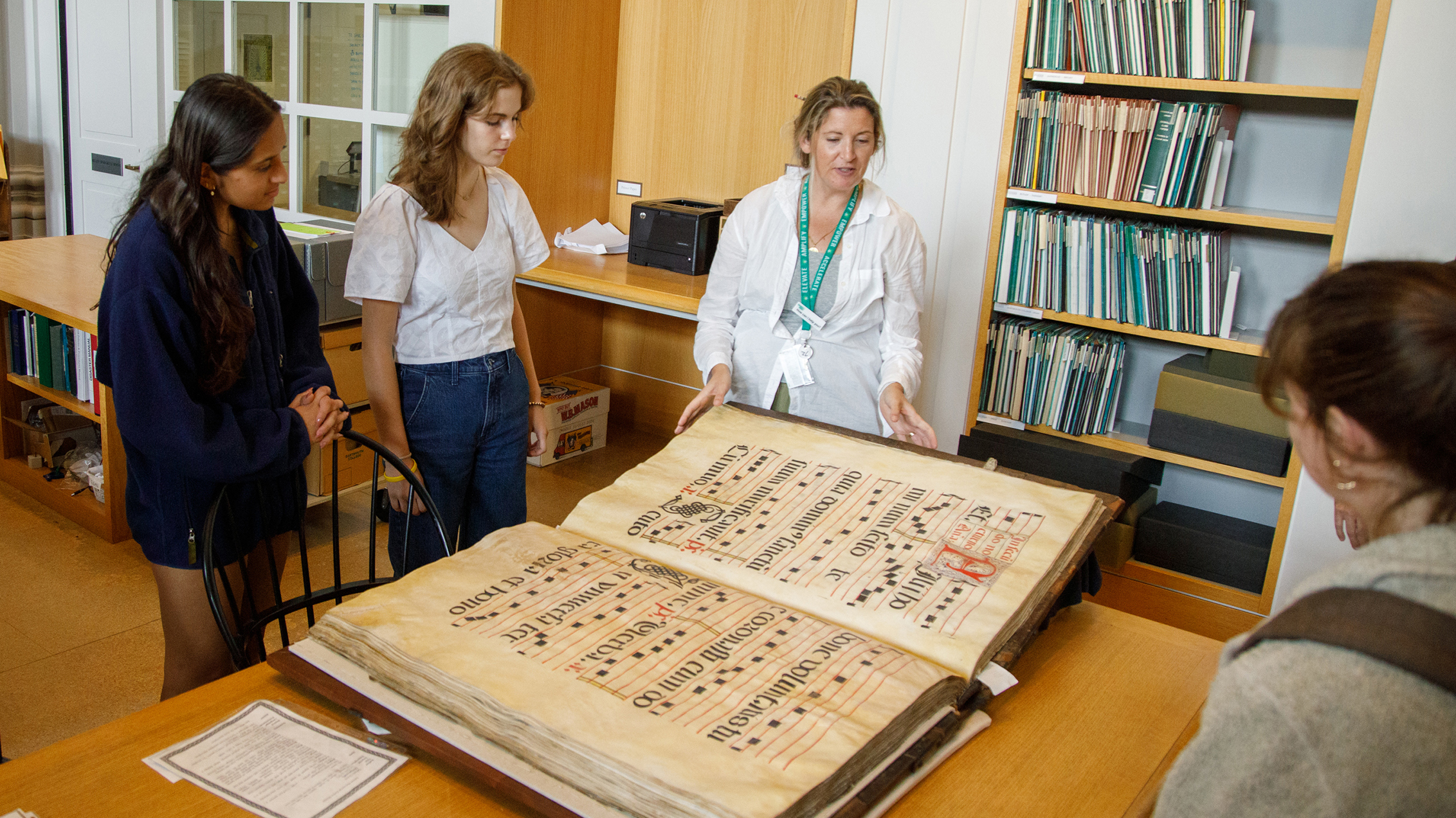 Students view large score in special collections