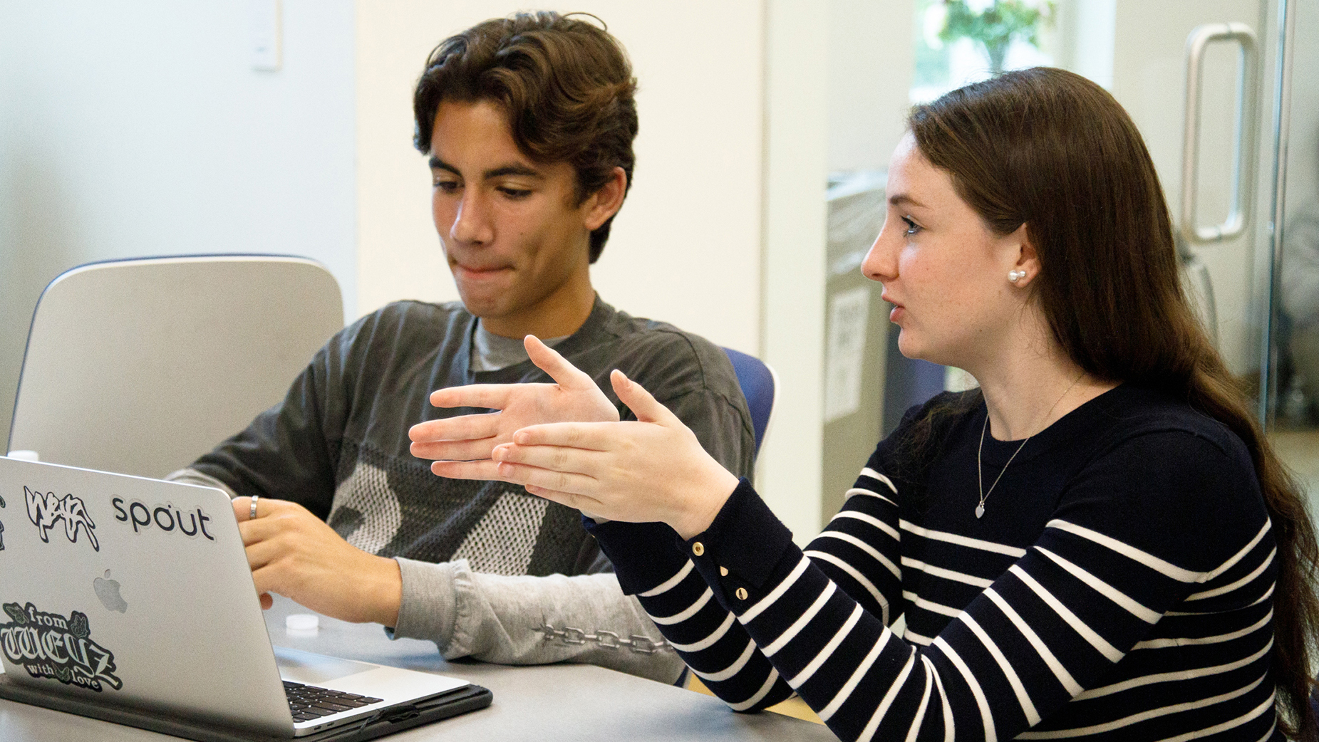 An assistant mentors a student