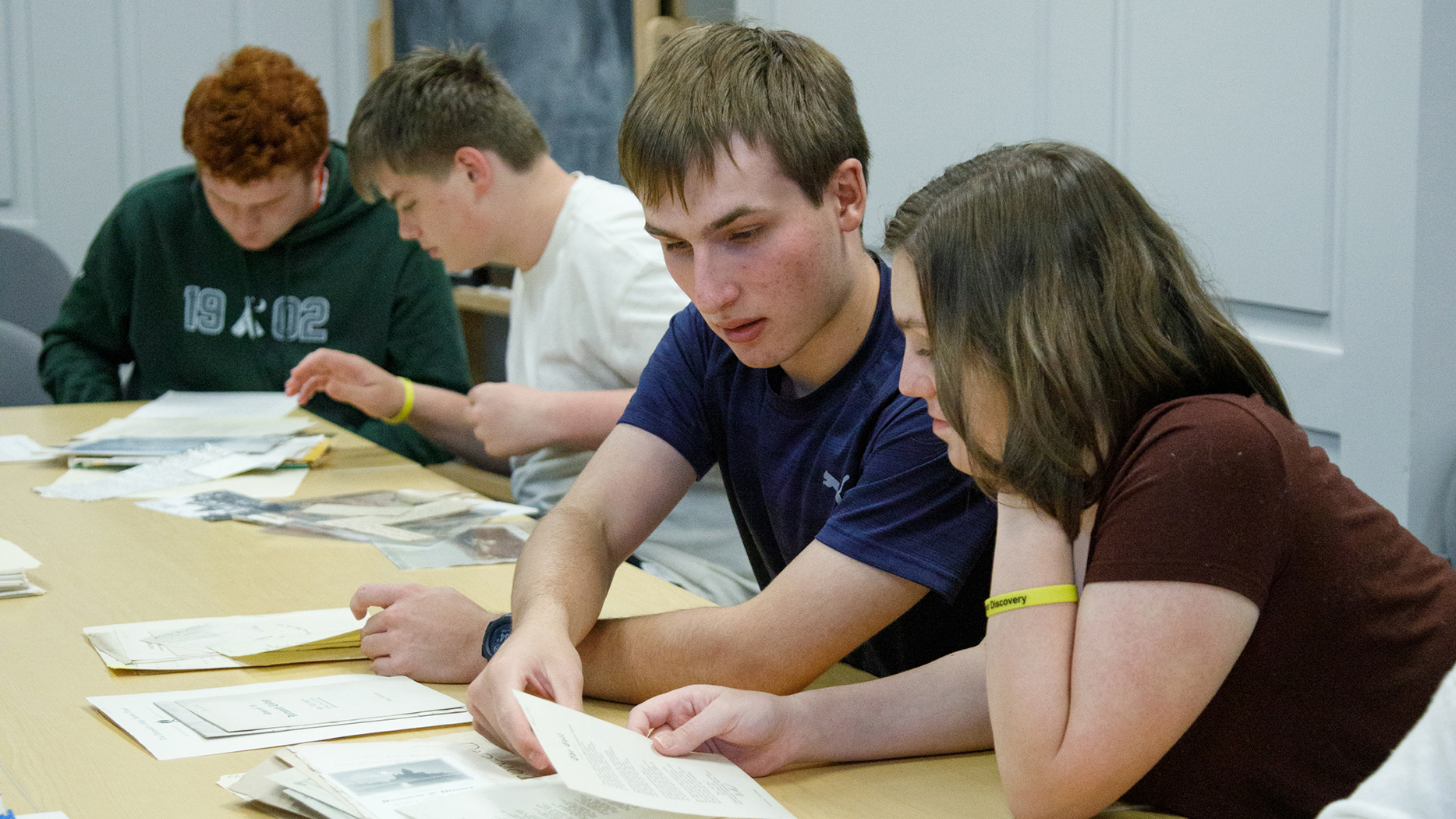 Students work together analyzing documents